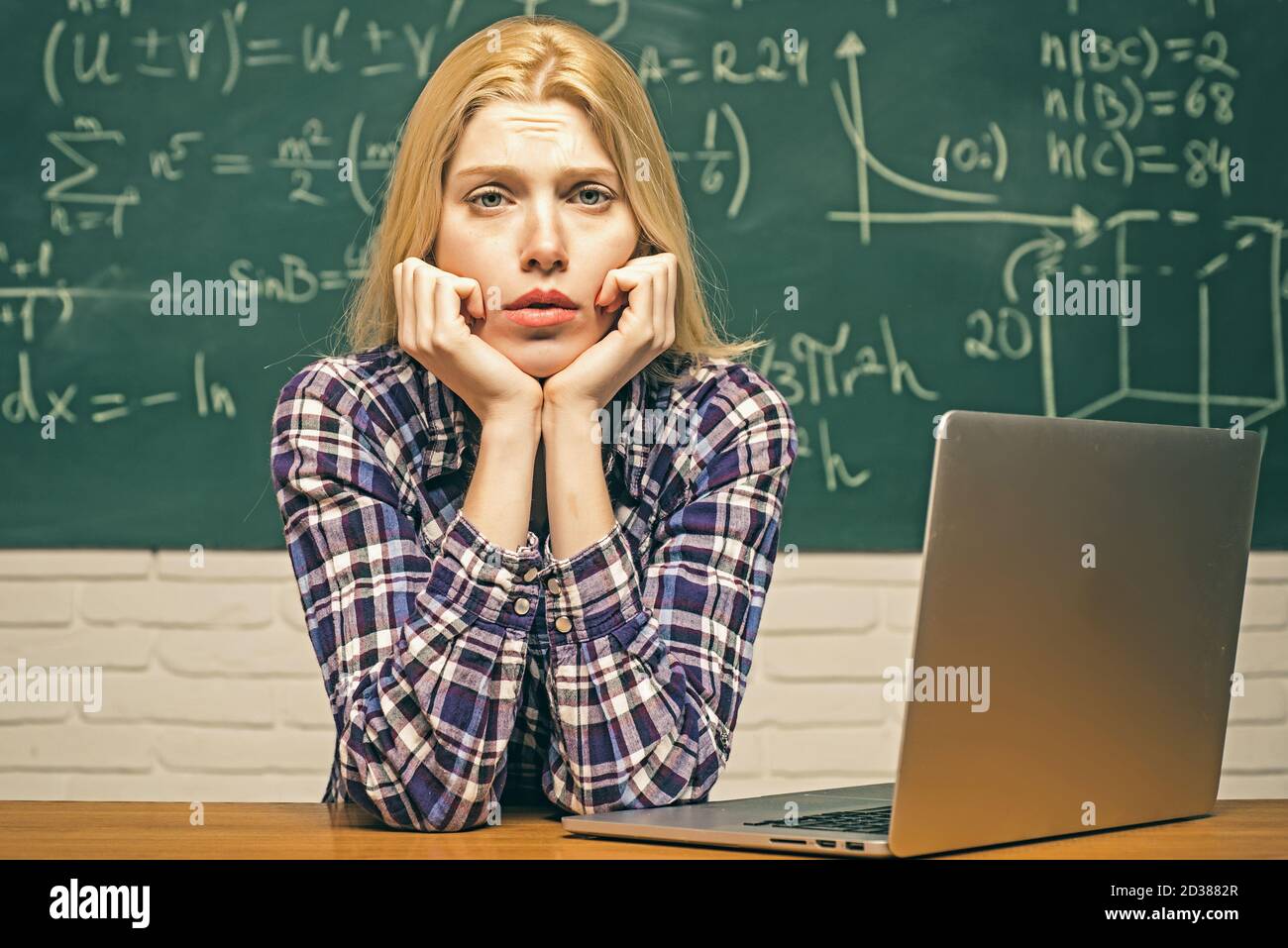 Start-up. Nerd funny student preparing for university exams. High school.  Portrait of tired serious female student. Student sitting at desks in Stock  Photo - Alamy