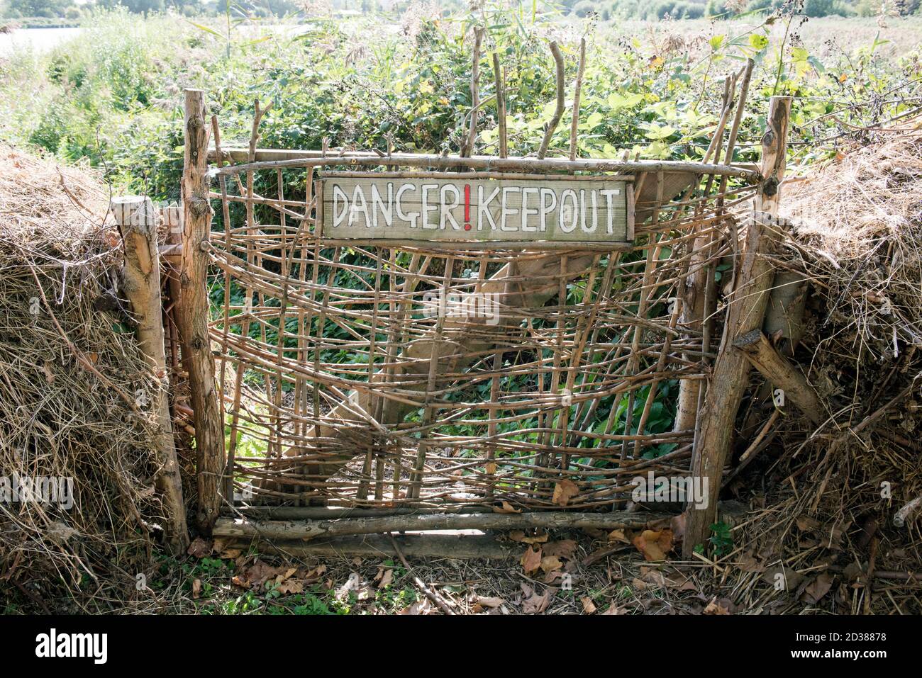 Rustic wicker gate with wooden - Danger Keep Out - sign, Woodberry Wetland urban nature reserve Stoke Newington London Borough of Hackney Stock Photo