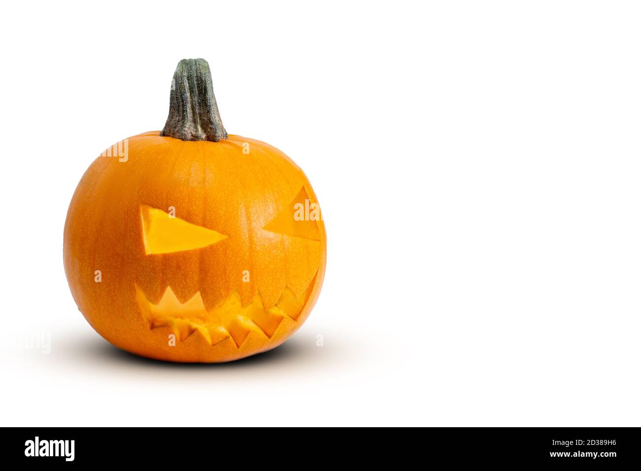 Jack o Lantern isolated on a white bakcground with light inside. Stock Photo