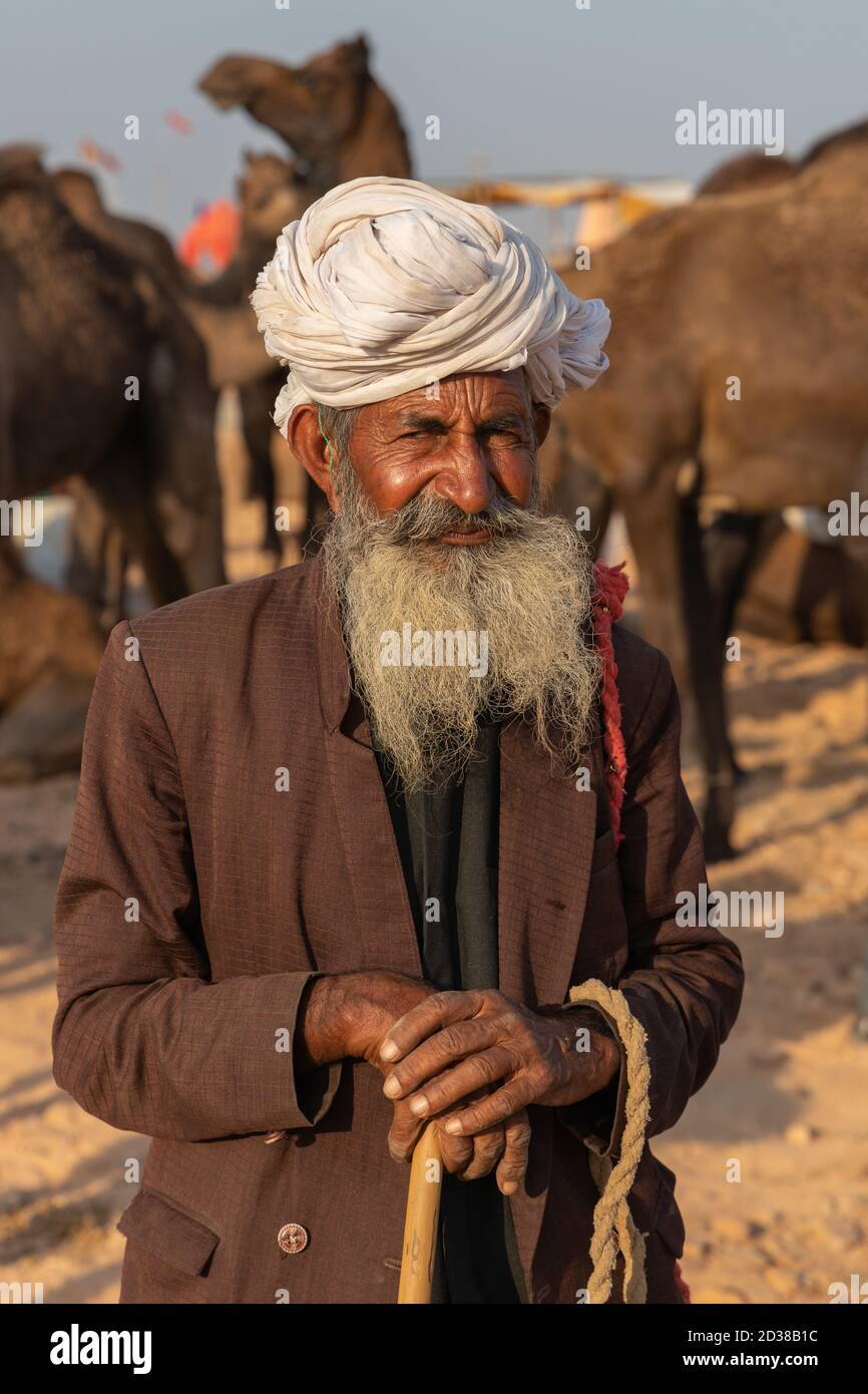 Portrait of an old Indian man wearing a turban and long grey beard at Pushkar, Rajasthan, India on 19 November 2018 Stock Photo