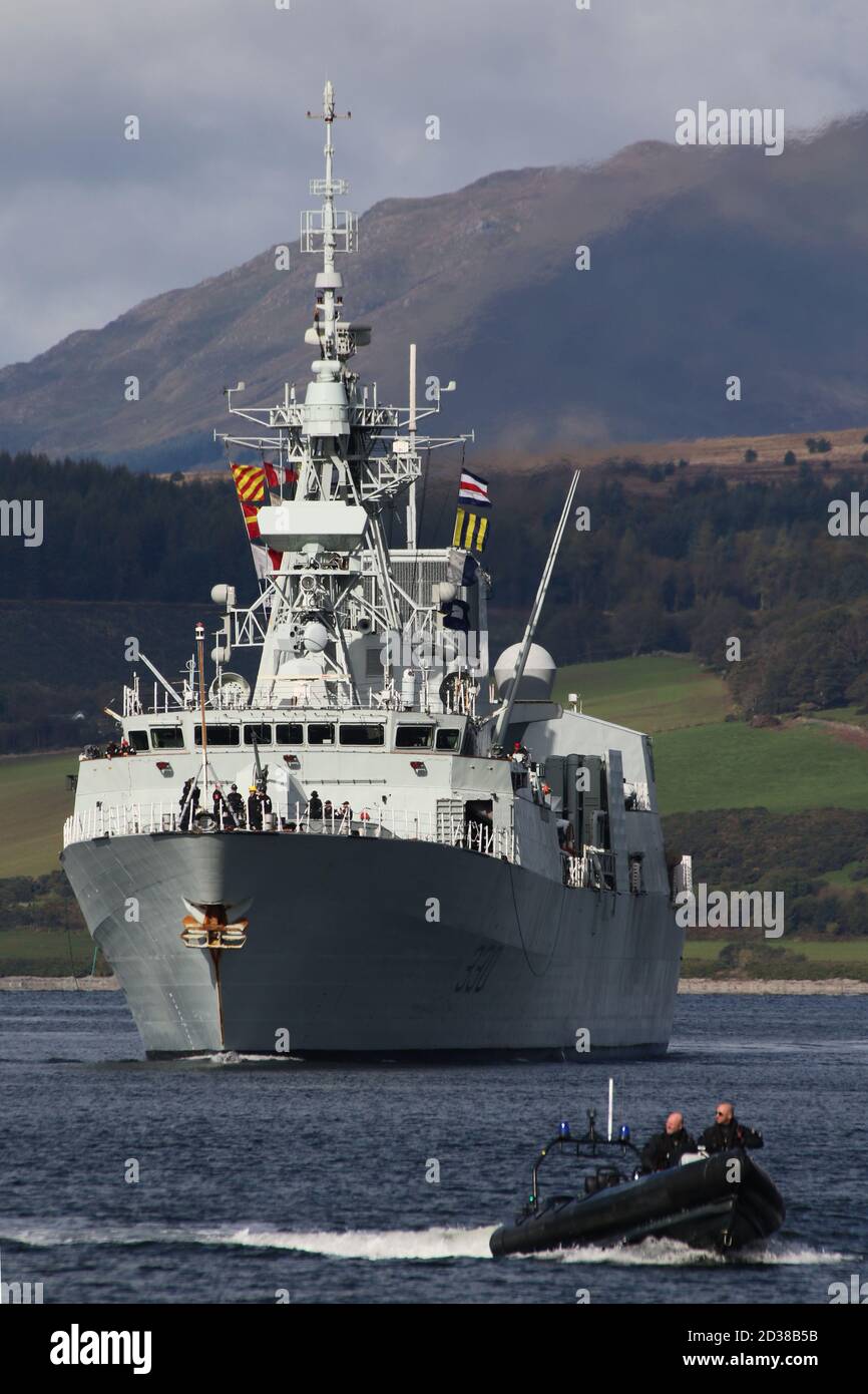 HMCS Halifax (FFH-330), a Halifax-class (or City-class) frigate operated by the Royal Canadian Navy, passes Greenock on her arrival for Exercise Joint Warrior, with a Ministry of Defence Police escort. Stock Photo