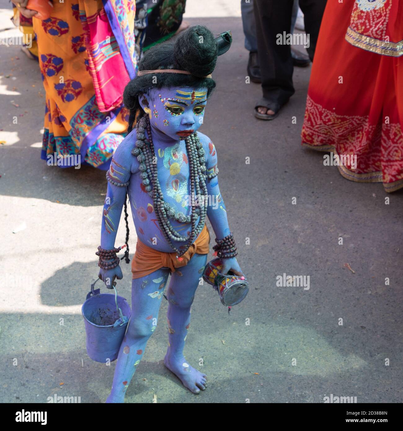 A little boy with his body painted blue to depict hinhu god Shive on the streets of Pushkar, Rajasthan, India on 28 October 2017 Stock Photo