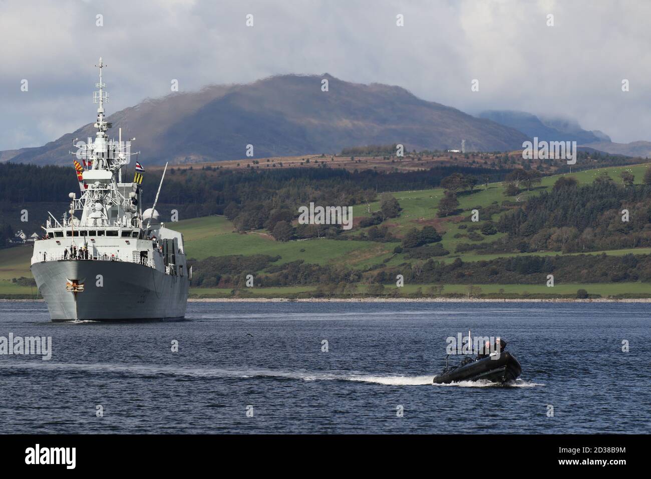 HMCS Halifax (FFH-330), a Halifax-class (or City-class) frigate operated by the Royal Canadian Navy, passes Greenock on her arrival for Exercise Joint Warrior, with a Ministry of Defence Police escort. Stock Photo