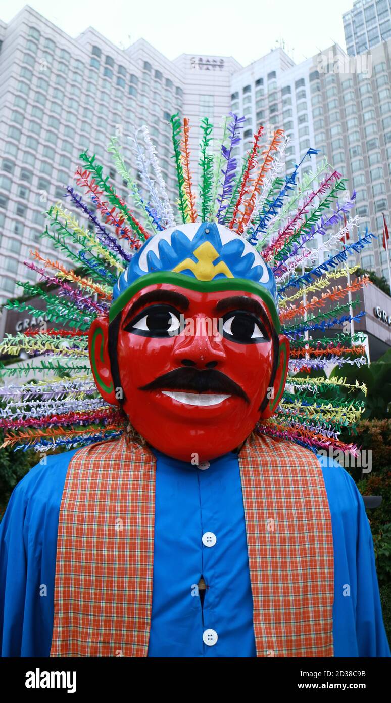 Jakarta, Indonesia - January 24, 2020: Ondel-ondel on tall building background. Ondel-ondel is giant puppet from Jakarta (Betawi culture). Stock Photo
