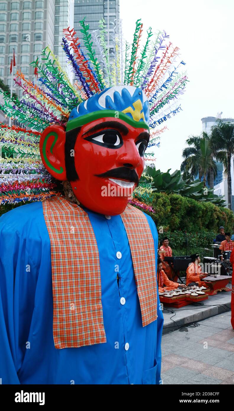 Jakarta, Indonesia - January 24, 2020: Ondel-ondel on tall building background. Ondel-ondel is giant puppet from Jakarta (Betawi culture). Stock Photo