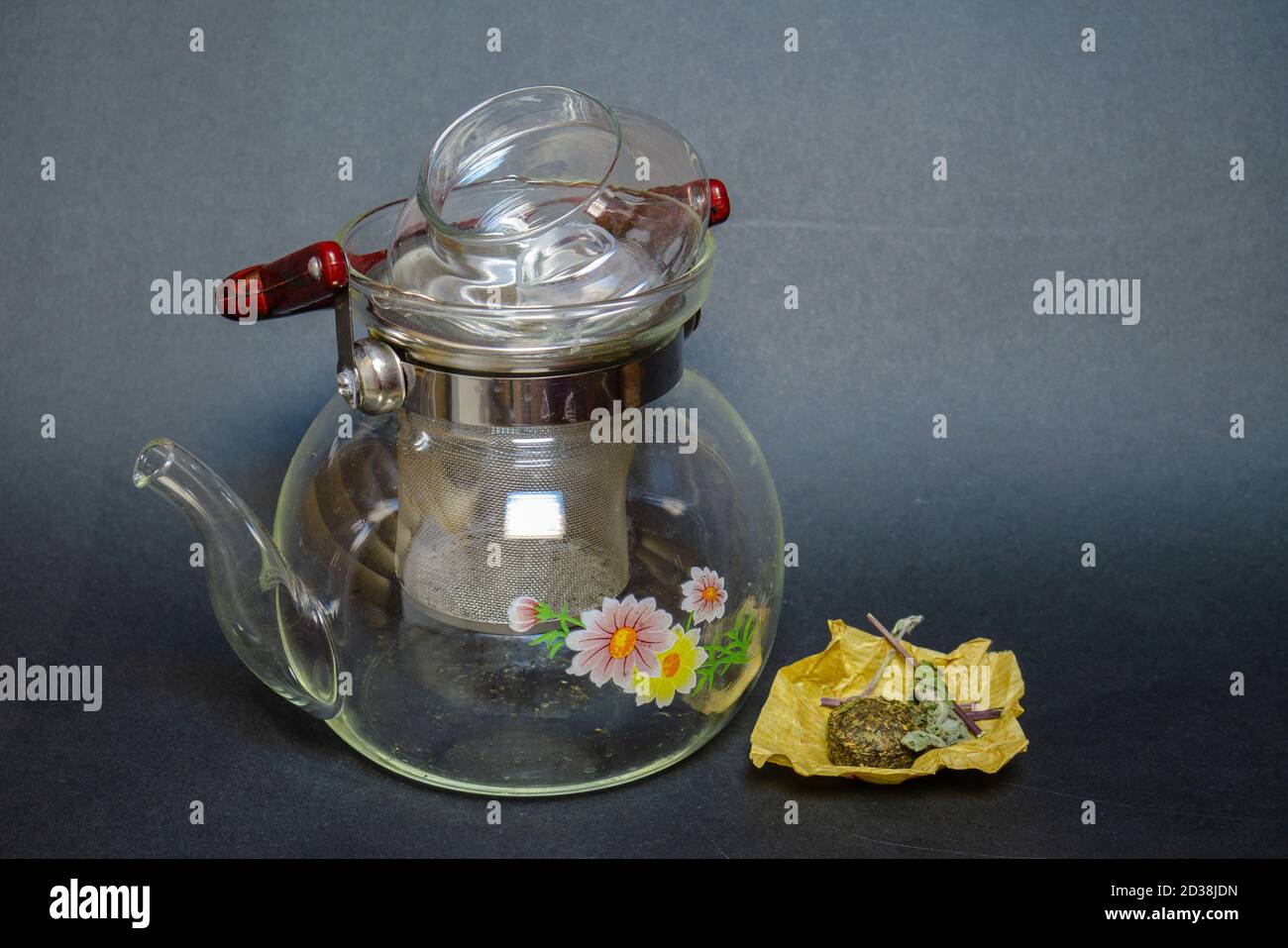 A kettle next to pressed green tea with mint Stock Photo Alamy