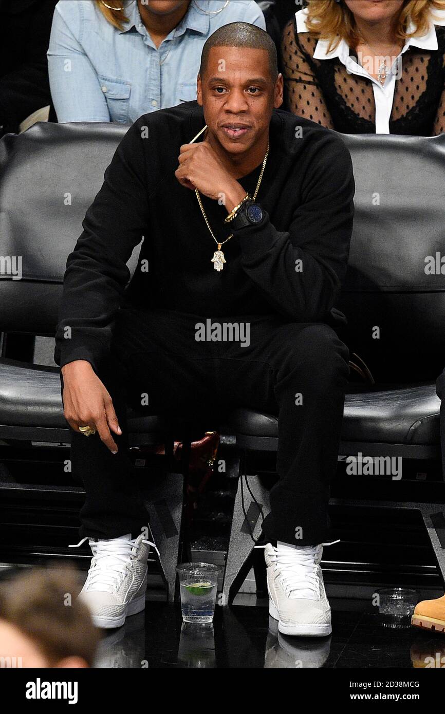 Rapper, agent, Jay Z looks on as the Brooklyn Nets take on Cleveland Cavaliers at Barclays Center in New York City on December 8, 2014. Stock Photo
