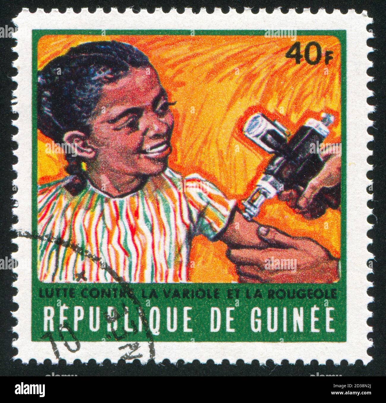 GUINEA CIRCA 1970: stamp printed by Guinea, shows Girl receiving vaccination, circa 1970 Stock Photo