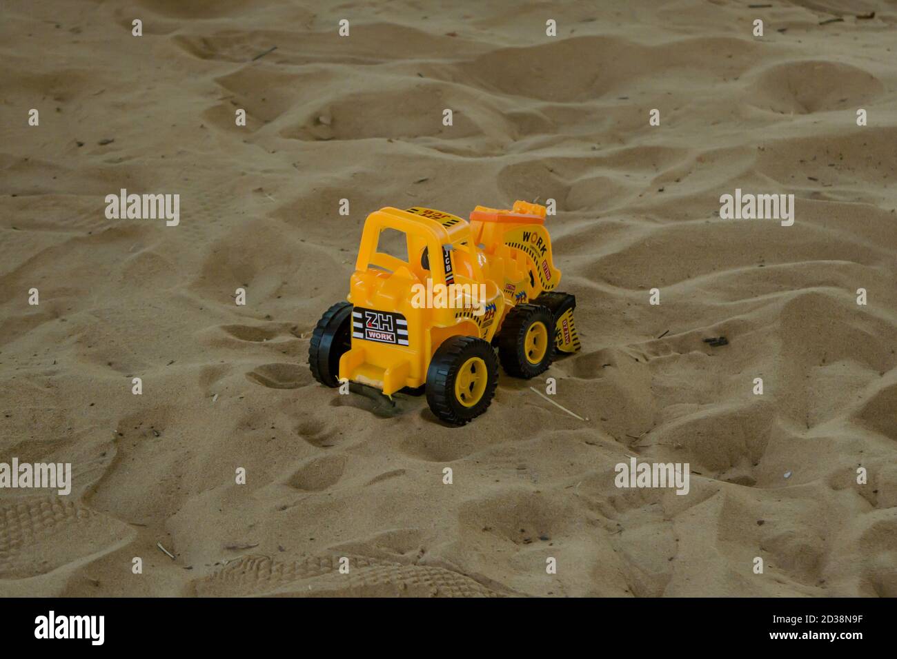 JCB Toy working on send, Construction Toys Stock Photo