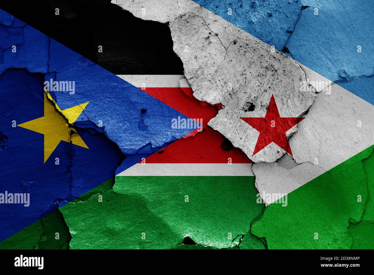 flags of South Sudan and Djibouti painted on cracked wall Stock Photo
