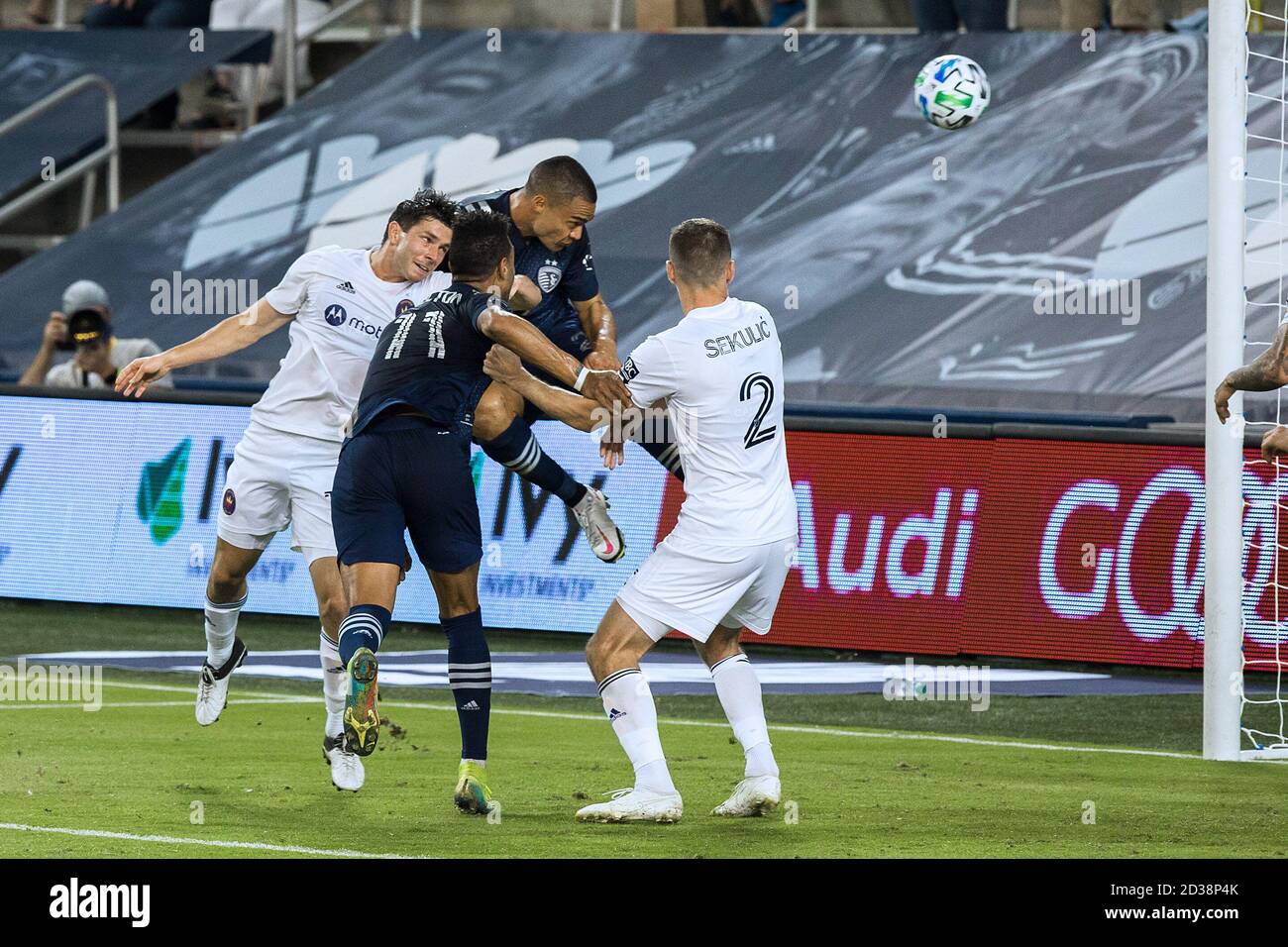 Kansas City, Kansas, USA. 13th Sep, 2020. Sporting KC defender Winston Reid #22 scores with a header shot during the second half of the game. At foreground (l-r) are Chicago Fire midfielder Brandt Bronico #13, Sporting KC midfielder Roger Espinoza #15, and Chicago Fire defender Boris Sekulic #2. Credit: Serena S.Y. Hsu/ZUMA Wire/Alamy Live News Stock Photo