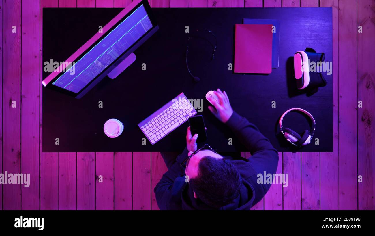 Hacker using mobile smartphone and stealing personal information Stock Photo