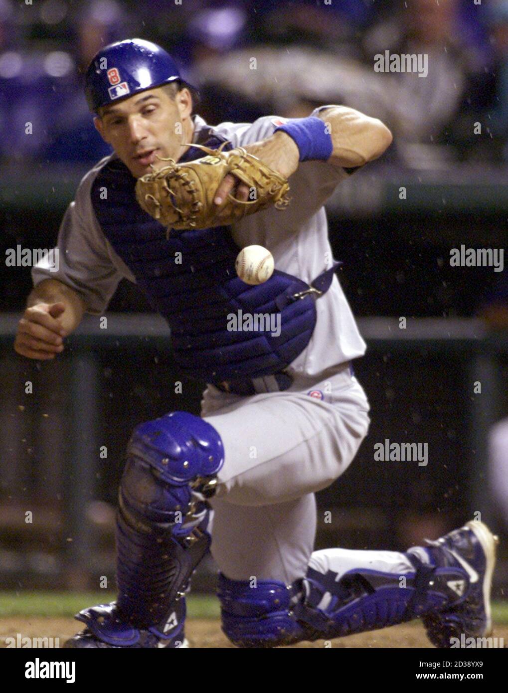 Chicago Cubs Catcher Joe Girardi Bobbles A Throw From Cubs Second Base Man Eric Young In The Fourth Inning Allowing Colorado Rockies Runner Todd Walker To Score From Third Base In Denver