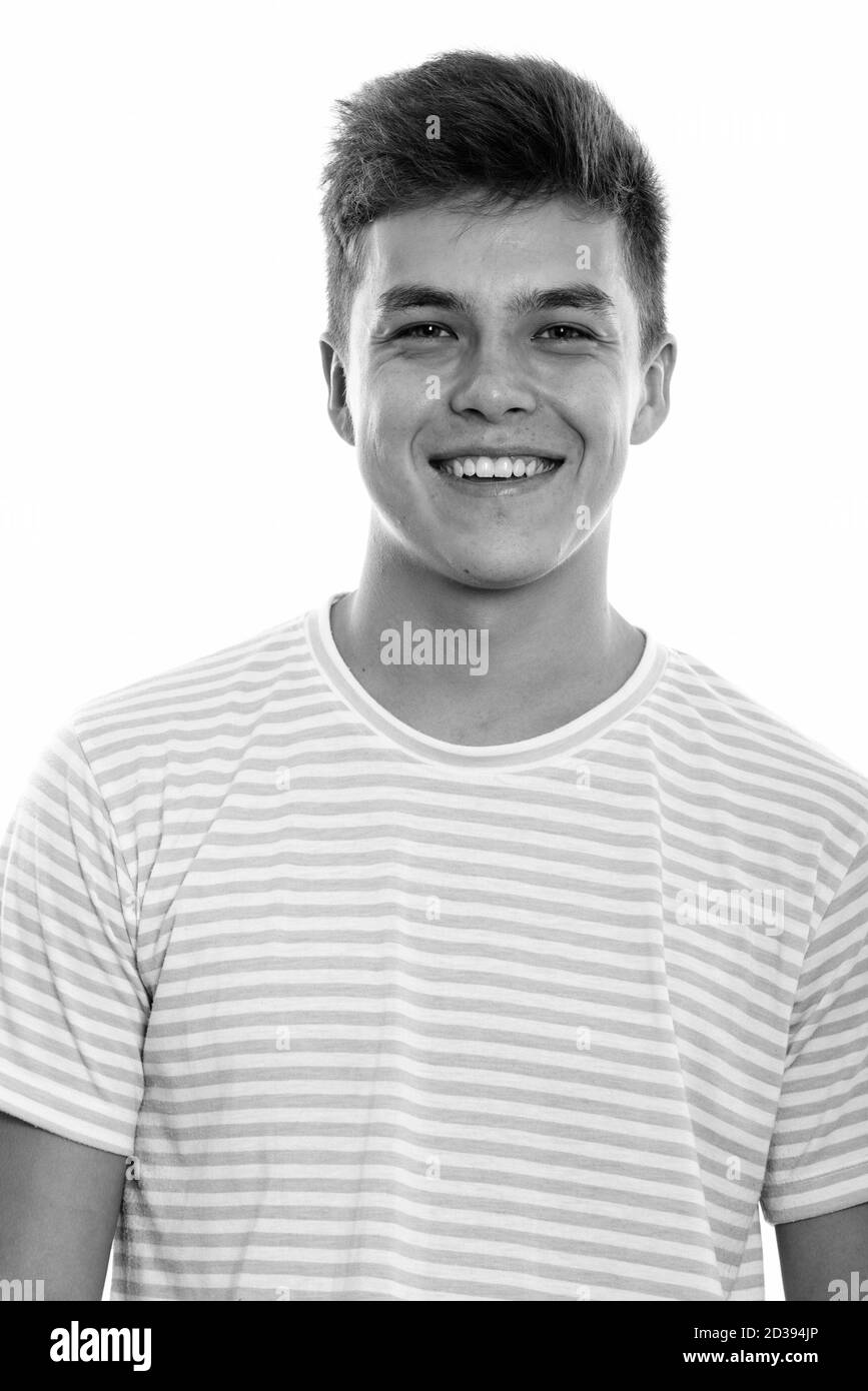Studio shot of young happy man smiling Stock Photo