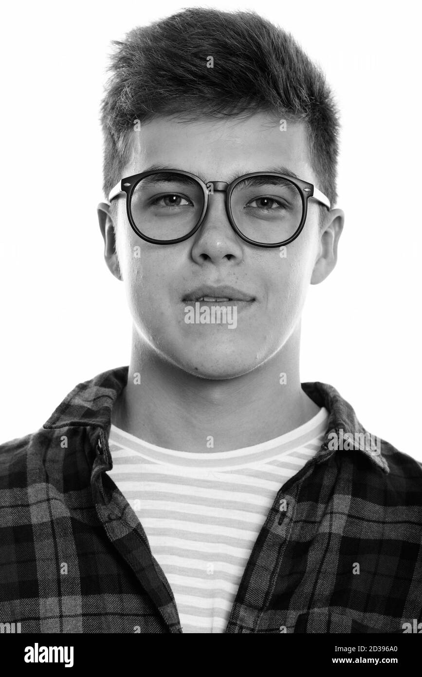 Face of young handsome man wearing eyeglasses Stock Photo