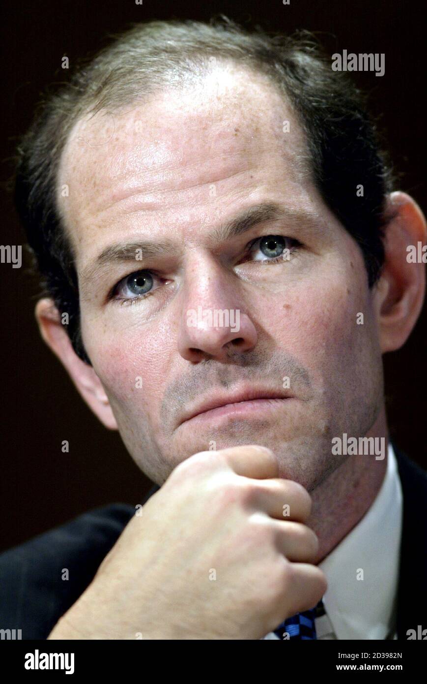 New York Attorney General Eliot Spitzer listens to opening remarks from members of the Senate Governmental Affairs Subcommittee on Financial Management, the Budget, and International Security, during a hearing on Capitol Hill, November 3, 2003. The hearing was called to investigate abuses in the mutual fund industry. Stock Photo