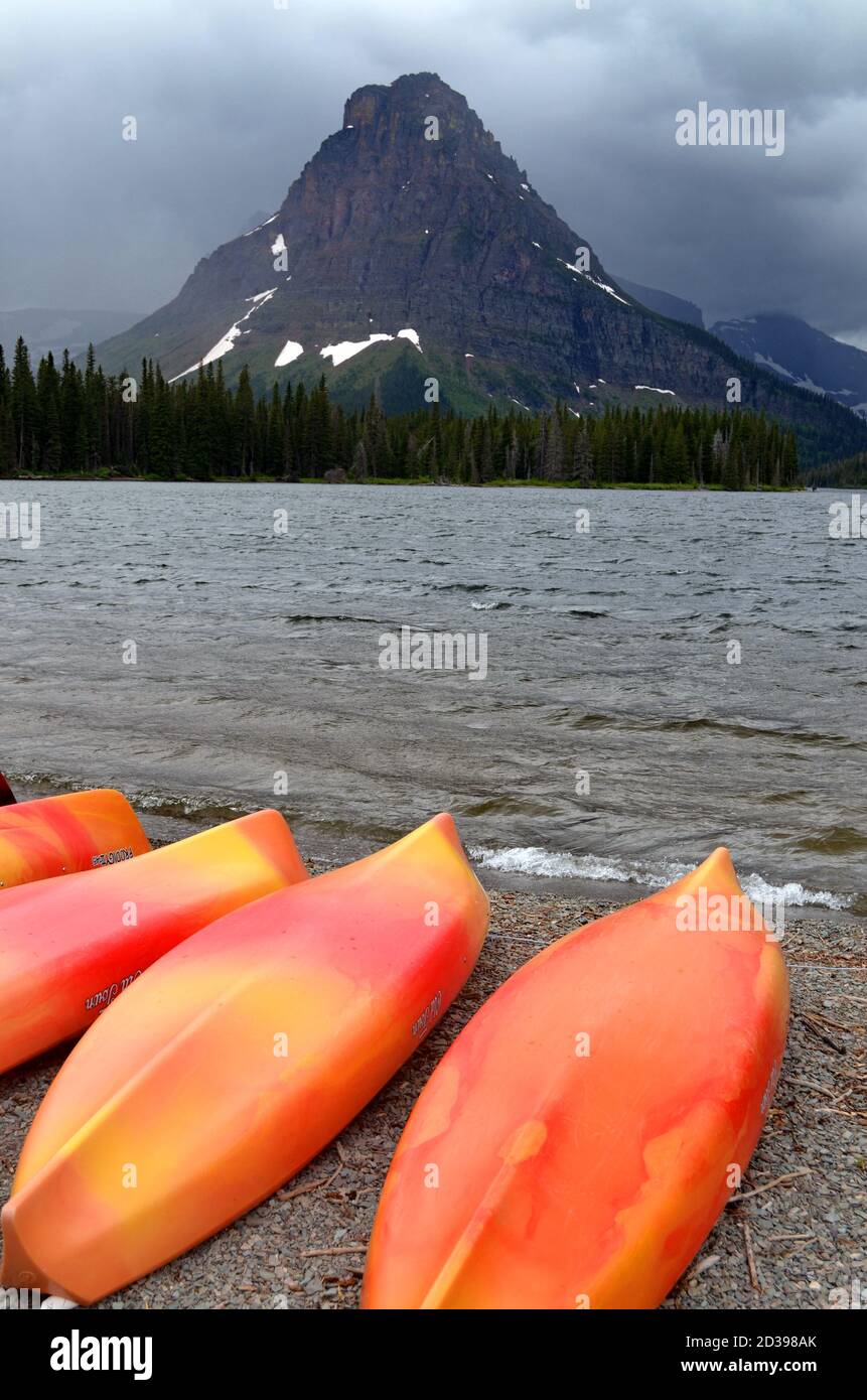 Montana Mountain & Kayaks by Cloudy Two Medicine Lake Stock Photo Alamy