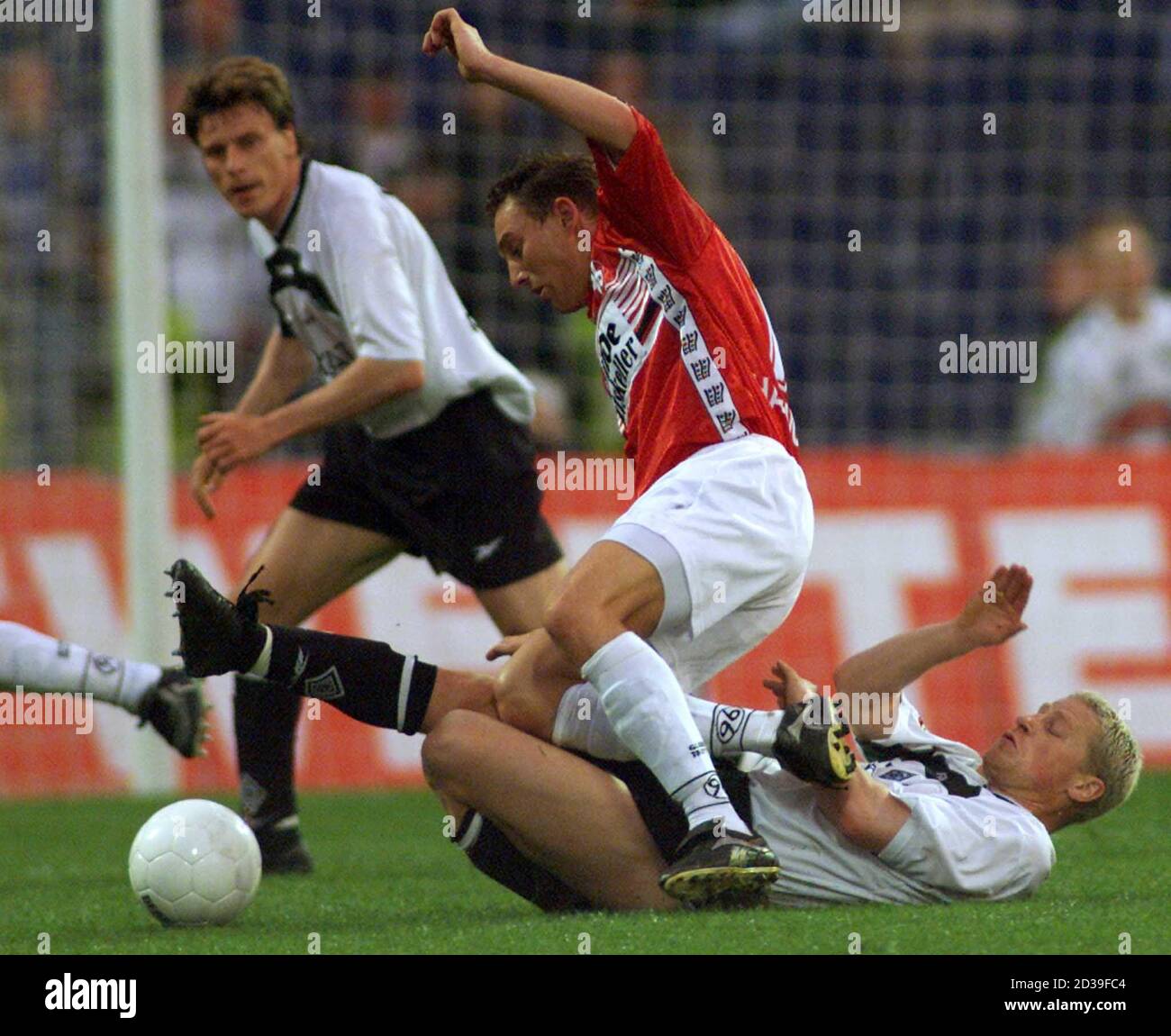 Steffen Korell (bottom) of Borussia Moenchengladbach is tackled by Oliver Schaefer (top) of Hanover 96 during their second division match in Hanover May 7, 2001. The match ended in a 0-0 draw.  FAB/ Stock Photo