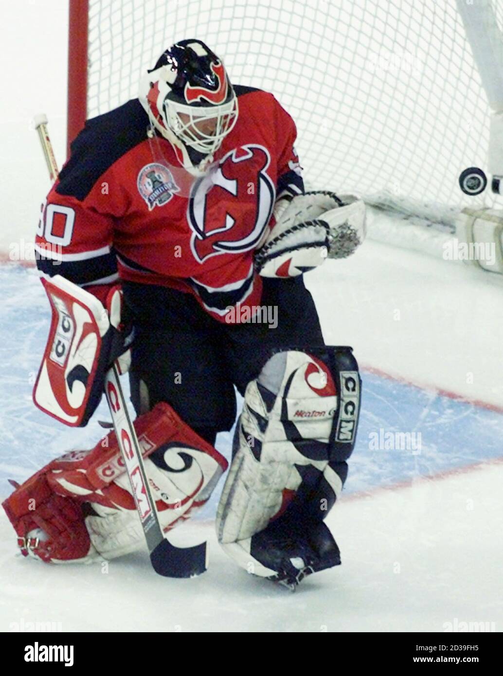 New Jersey Devils goalie Martin Brodeur saves a shot on goal in the first  period of Game 2 of the Stanley Cup Finals May 26, 2001 against the  Colorado Avalanche in Denver.