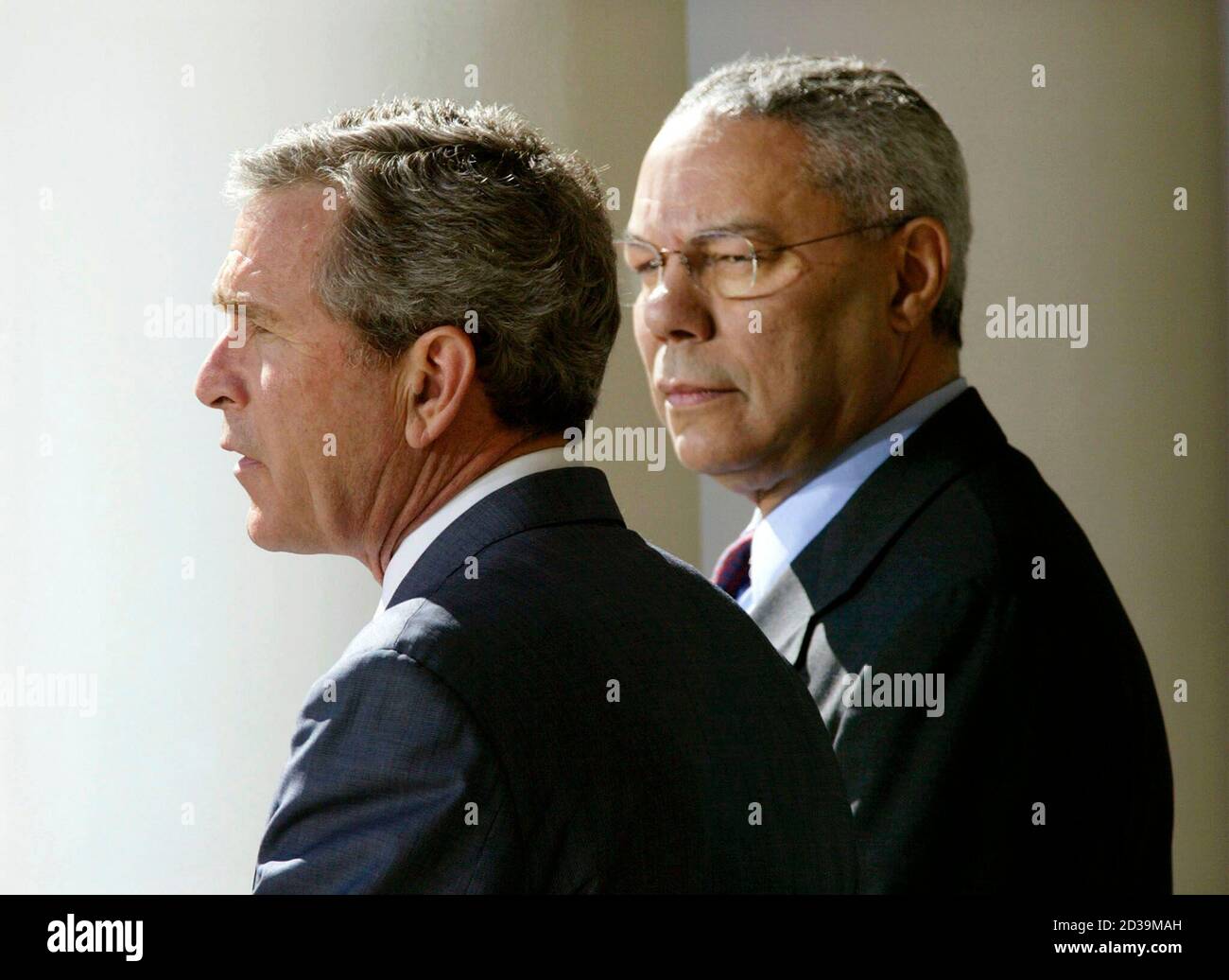U S President George W Bush L Stands With Secretary Of State Colin Powell As He Comments On A Middle East Peace Plan In The Rose Garden At The White House In Washington