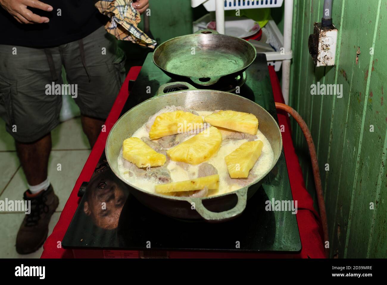 Man cooking a traditional dish on a Costa Rican domestic kitchen. Stock Photo