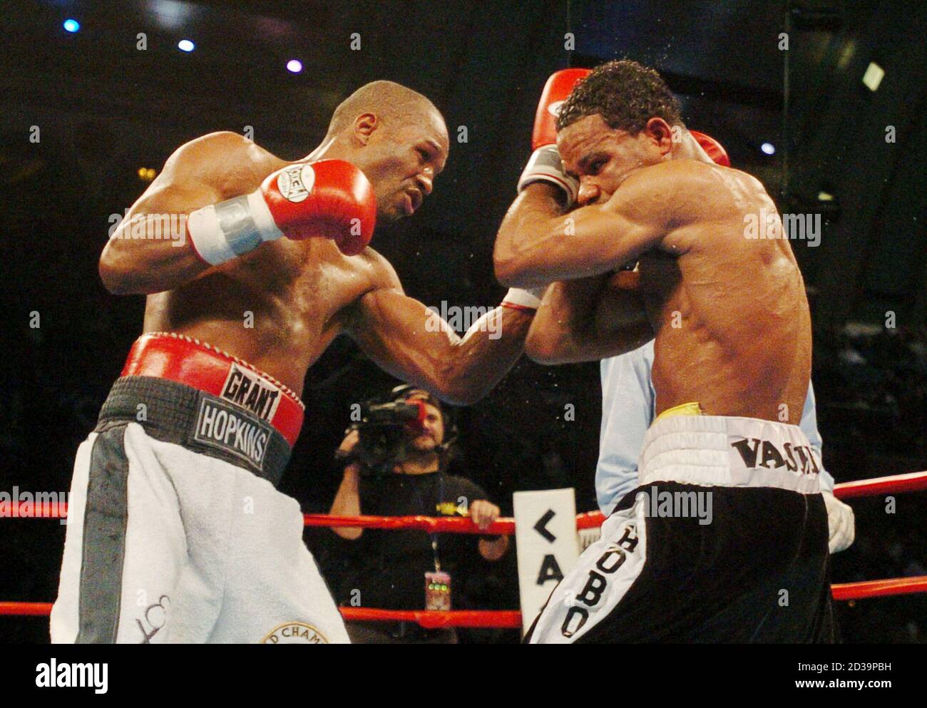 Undisputed middleweight champion Bernard Hopkins (L) lands a punch on his  opponent William Joppy (R) during the first round of their twelve round  fight in Atlantic City, December 13, 2003. Hopkins won