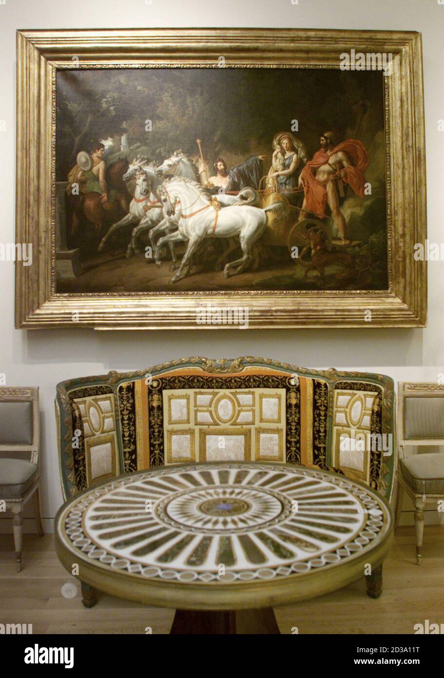 The painting "Le Retour D'Helene" and a mahogony and marble gueridon, in  foreground, are displayed at Sotheby's auction house in New York on March  30, 2001 where art and furnishings from the