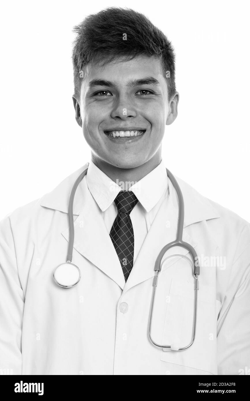 Studio shot of young happy man doctor smiling Stock Photo
