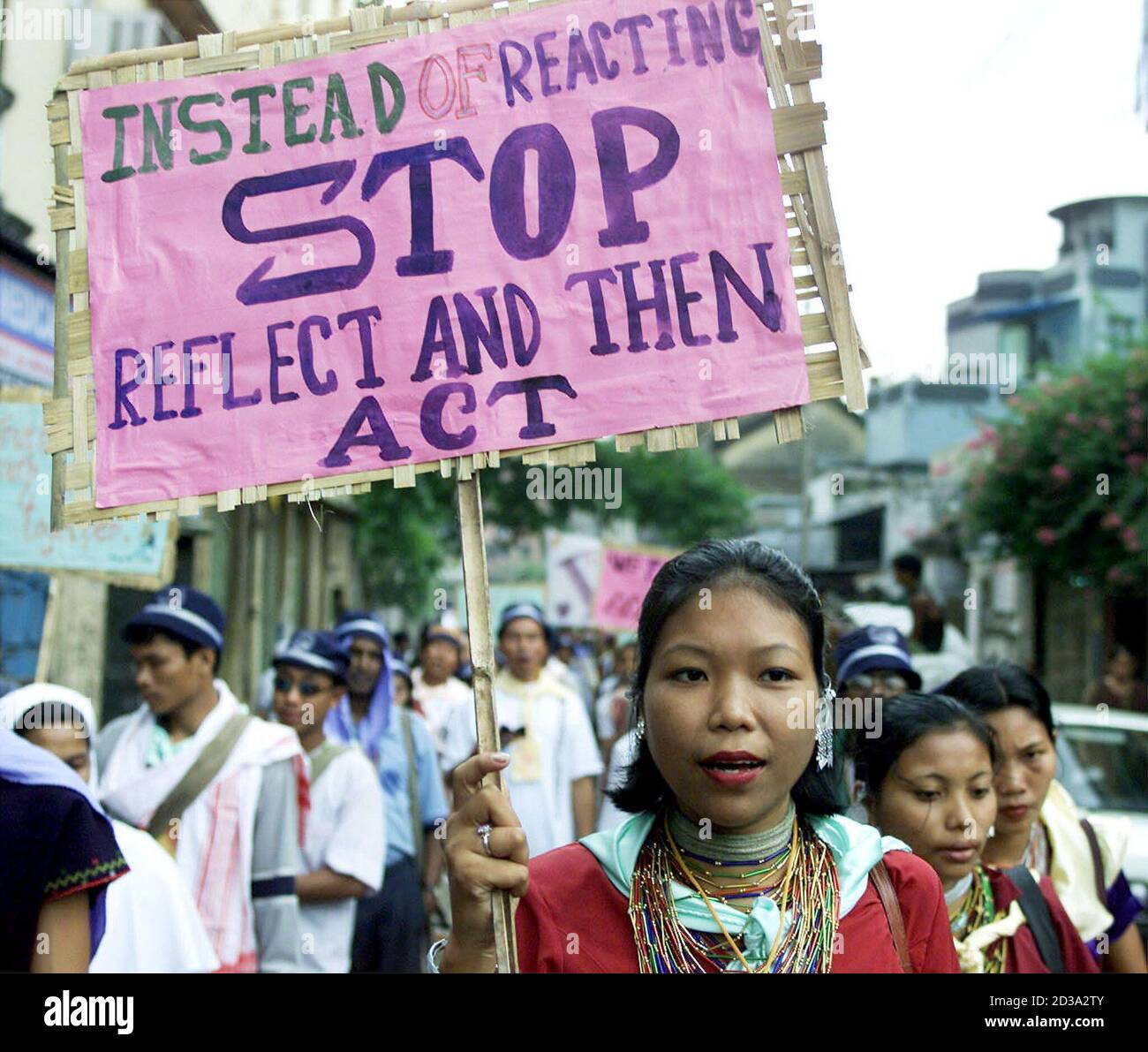 A Naga tribal woman from India's northeast region holds a placard during a rally in the eastern Indian city of Calcutta October 30, 2001. About 5,000 Indian youth took part in the rally organised by a Christian organisation to highlight the problems of youth worldwide including drug abuse and violence. REUTERS/Jayanta Shaw  JS/DL Stock Photo