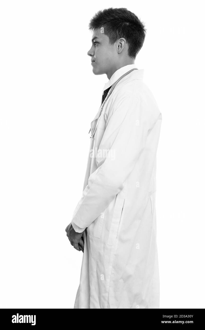 Profile view of young handsome man doctor standing Stock Photo