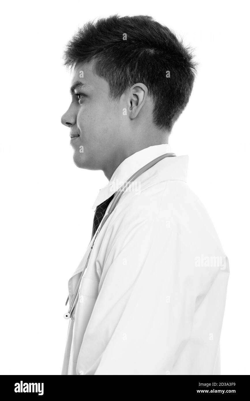 Profile view of young handsome man doctor Stock Photo