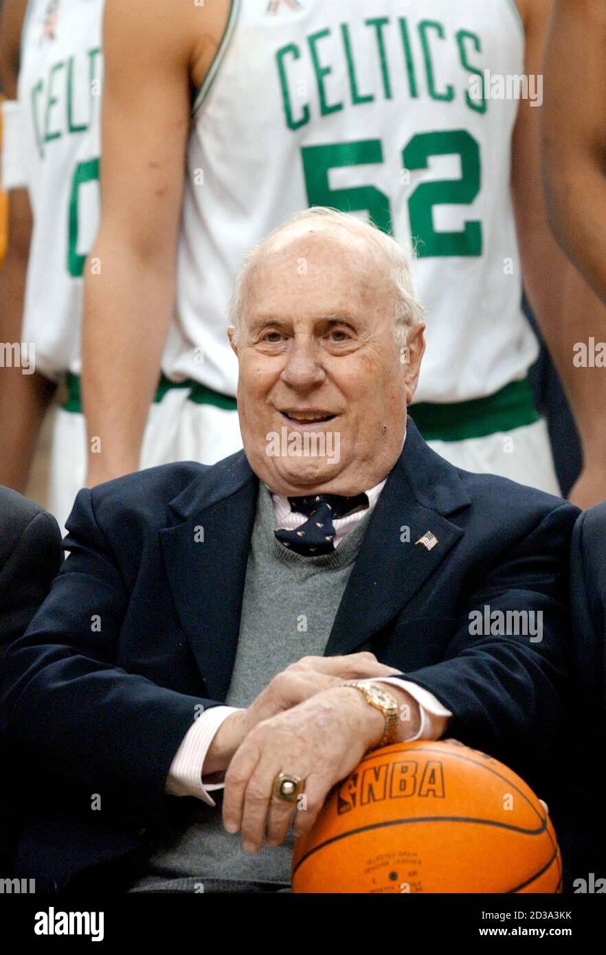 Red Auerbach, Vice Chariman of the Board and President of the Boston  Celtics, takes his place for the official team photo in Boston,  Massachusetts March 8, 2002. Auerbach has been with the