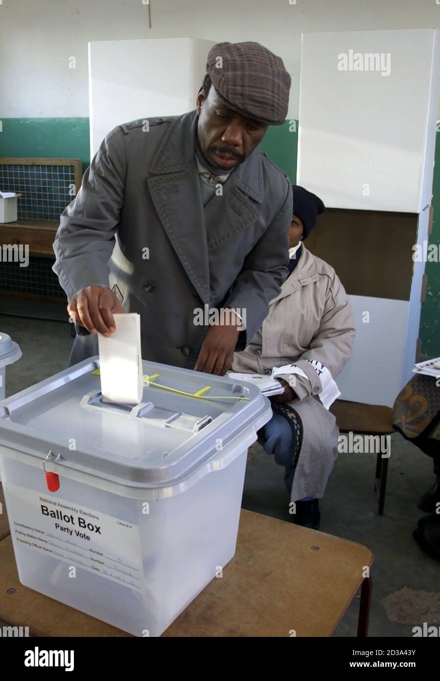 A Basotho man casts his ballot as voting gets off to a slow start in Lesotho's general election May 25, 2002. The tiny southern African mountain kingdom is holding it's first election under a new electoral system with nineteen political parties competing for 80 constituency and 40 proportional representation seats. REUTERS/Mike Hutchings  MH/ Stock Photo