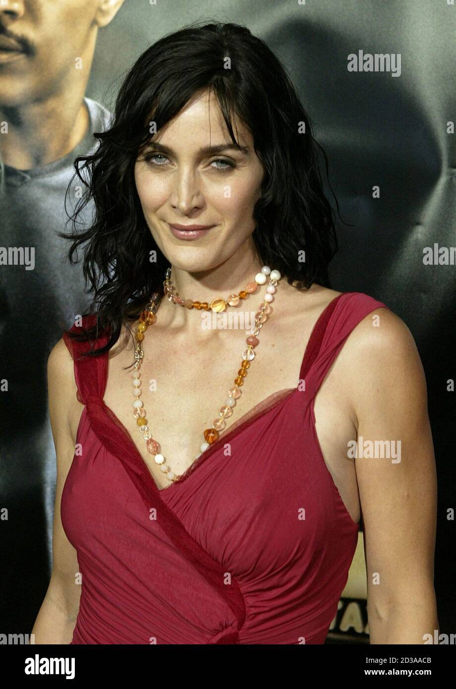 Actress Carrie Anne Moss arrives as a guest for the premiere of the new thriller film 'Collateral'in Los Angeles August 2, 2004. [The film tells the story of a cab driver, played by Jamie Foxx, who finds himself the hostage of an engaging contract killer, played by Tom Cruise, as he makes his rounds from hit to hit during one night in Los Angeles. The film, directed by Michael Mann opens August 6 in the United States.] Stock Photo