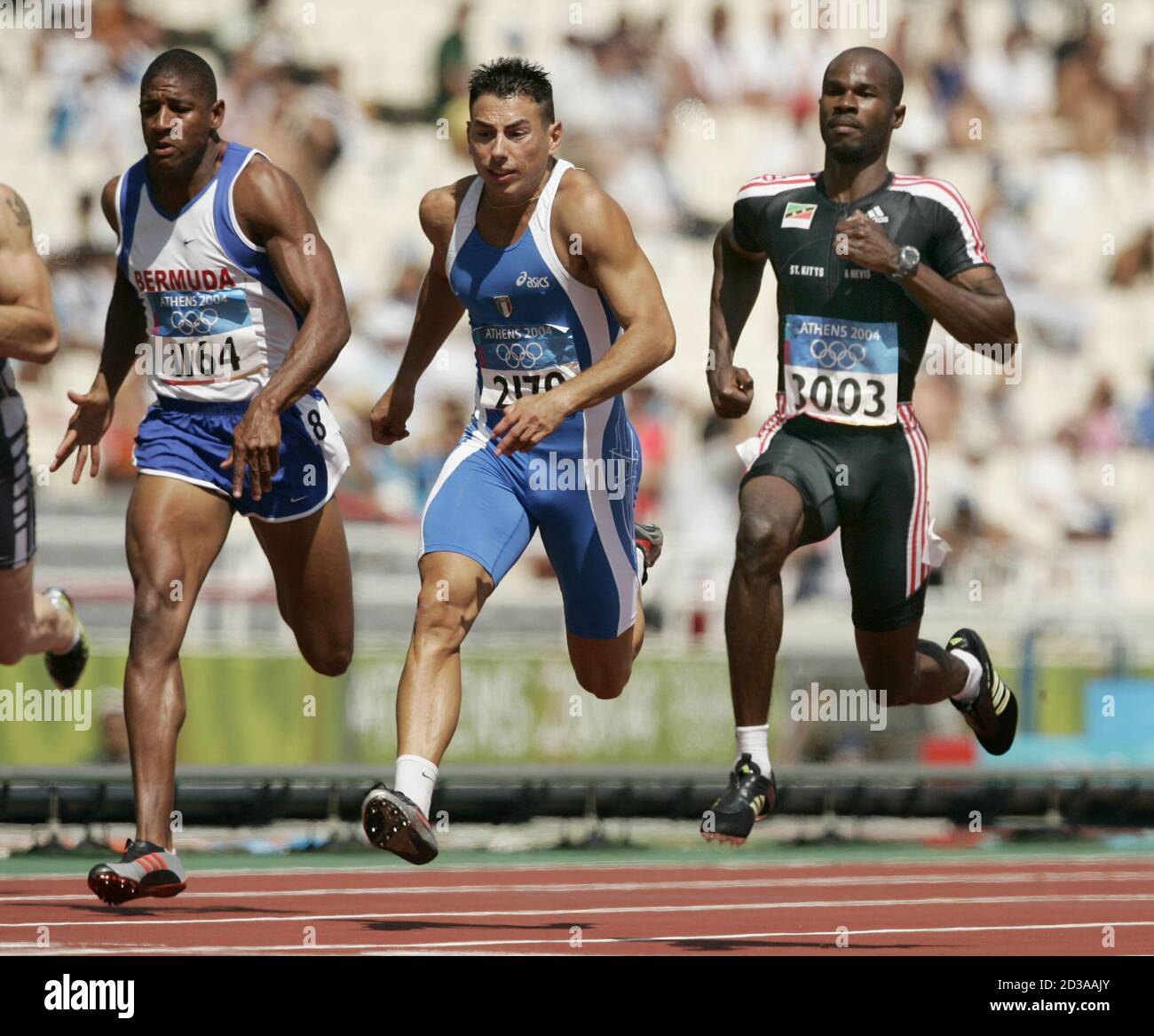 Bermudas Xavier James, Italys Simone Collio and Kim Collins of St Kitts and  Nevis run during the men's 100 metres event in Athens. Bermuda's Xavier  James, Italy's Simone Collio and Kim Collins