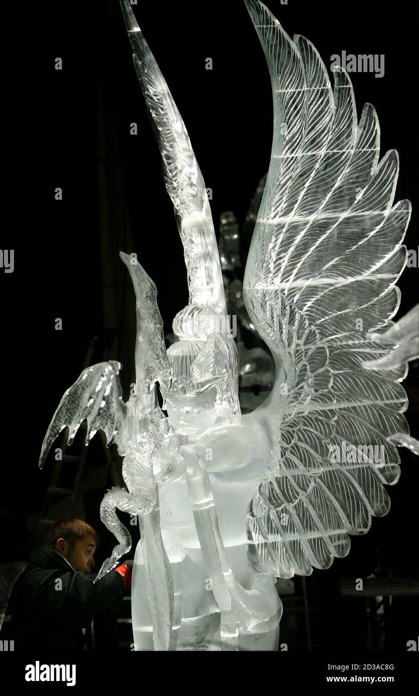 Japans Sone Makes Final Touches On His Ice Sculpture My Dear Dragon Baby During Iceart 04 World Championships In Luebeck Team Japans Hideyuki Sone Makes Final Touches On His Ice Sculpture My