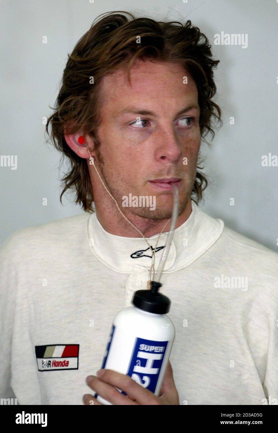 Bar Formula One Driver Jenson Button Of Britain Sips A Drink During The First Practice Session For The Bahrain Grand Prix At The Bahrain International Circuit In Sakhir South Of The Capital