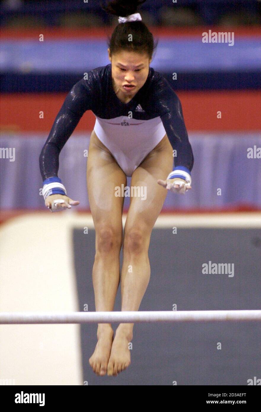 American Gymnast Amy Chow Competes On The Uneven Bars In The 