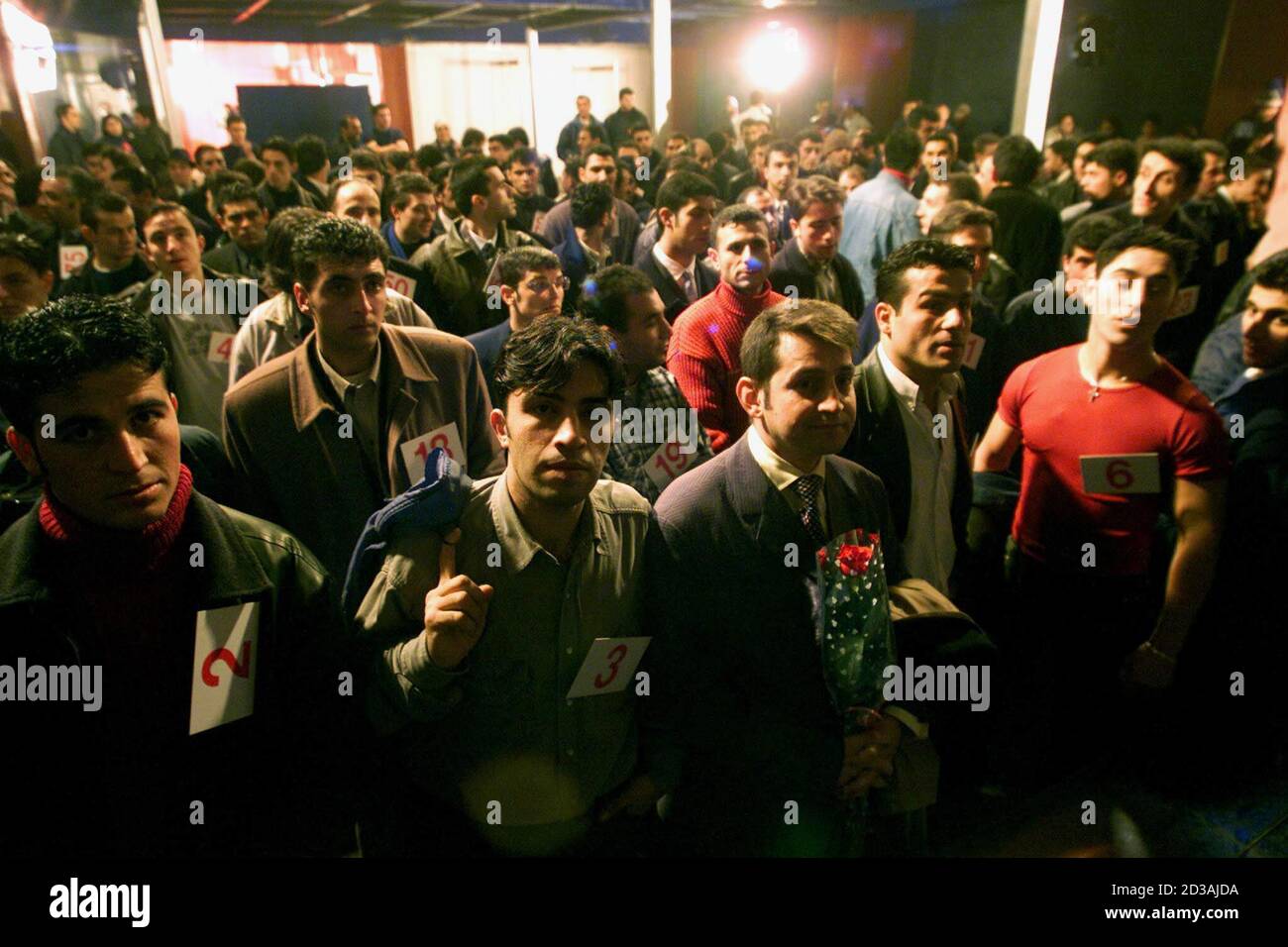 Turkish Men Wearing Suits Or Casual Outfits Some Holding Flowers Crowded Into A Disco In Istanbul alamy
