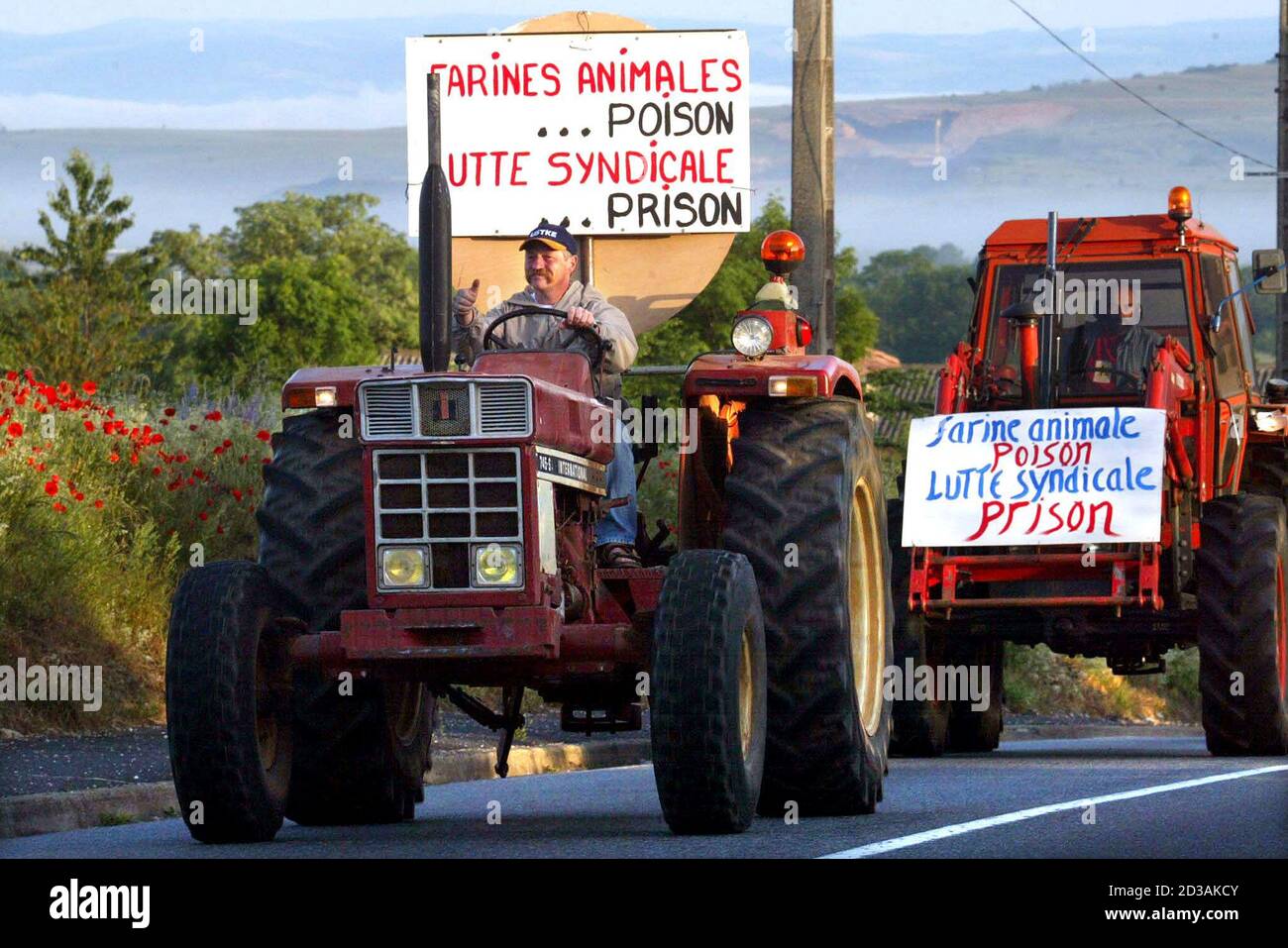 Jose Bove the radical French farmer and anti-golbalization leader heads a  convoy of tractors on his way to prison near Montpellier, June 19, 2002,  [after he was convicted of the ransacking of