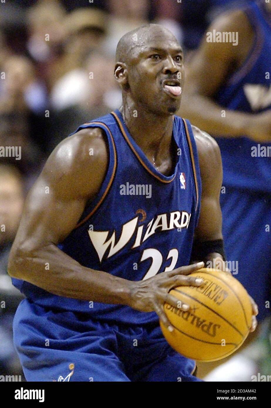 Washington Wizards guard Michael Jordan sticks out his tongue before  shooting against the Philadelphia 76ers during second quarter NBA action in  Philadelphia, November 17, 2002. Jordan and the Wizards lost to the