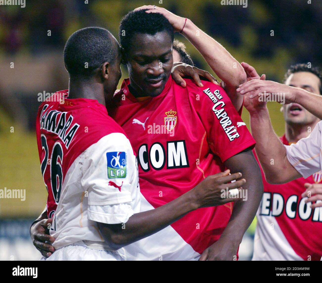 Monaco's Shabani Nonda (C) is congratulated by team mate Souleymane Camara(L)  after he scored a goal during the french league soccer match between Monaco  and Guingamp in Monaco December 15, 2002. REUTERS/Eric