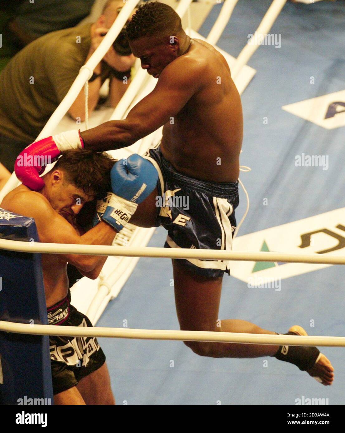Remy Bonjasky (R) from Holland, champion of K-1 World Grand Prix 2003 in  Las Vegas, attacks Aziz Khattou from Belgium at the super fight match of  the Aruze K-1 World Grand Prix