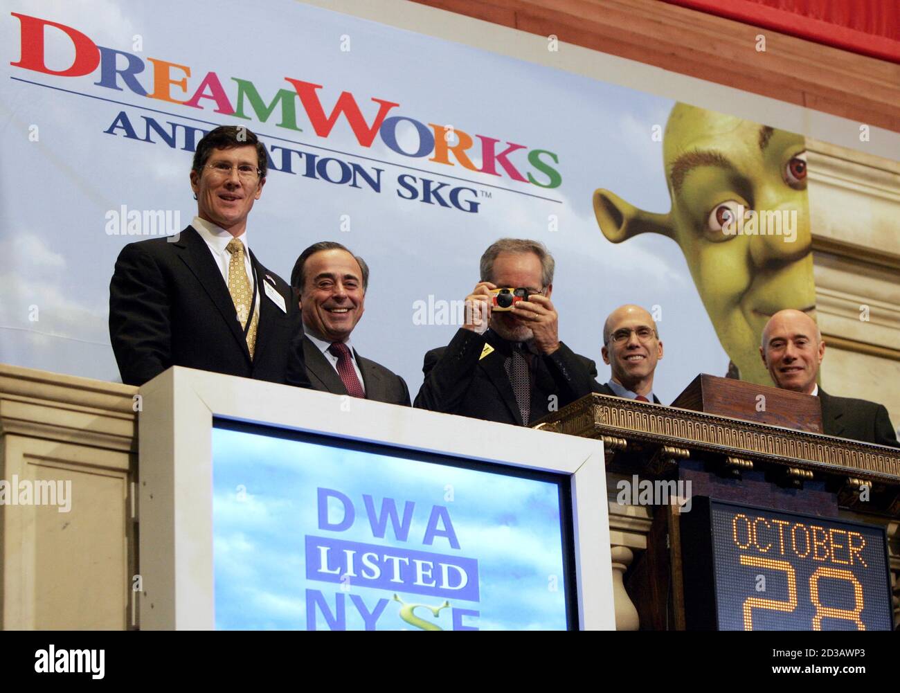 New York Stock Exchange Chairman John Thain L Poses With Dreamworks Founders David Geffen R Jeffrey Katzenberg 2nd R And Steven Spielberg C With Camera And Dreamworks Animation Skg Inc Executive Chairman