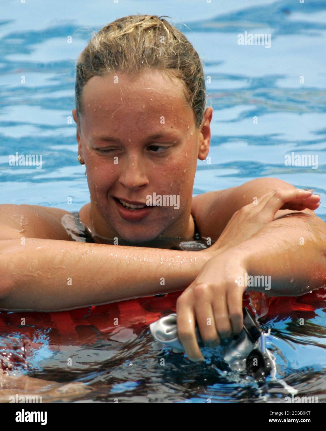 Italian swimmer Federica Pellegrini rests after finishing first overall