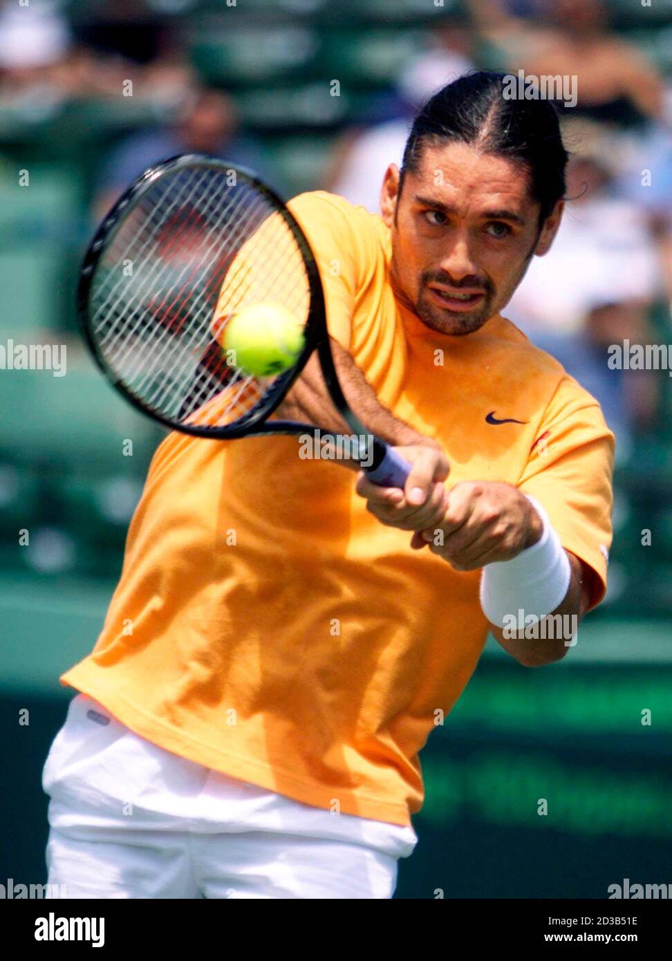 Chilean Marcelo Rios returns serve to American Andre Agassi in the first  set of their semifinal men's tennis match at the Nasdaq 100 Open March 29,  2002 in Key Biscayne, Florida. REUTERS/Marc
