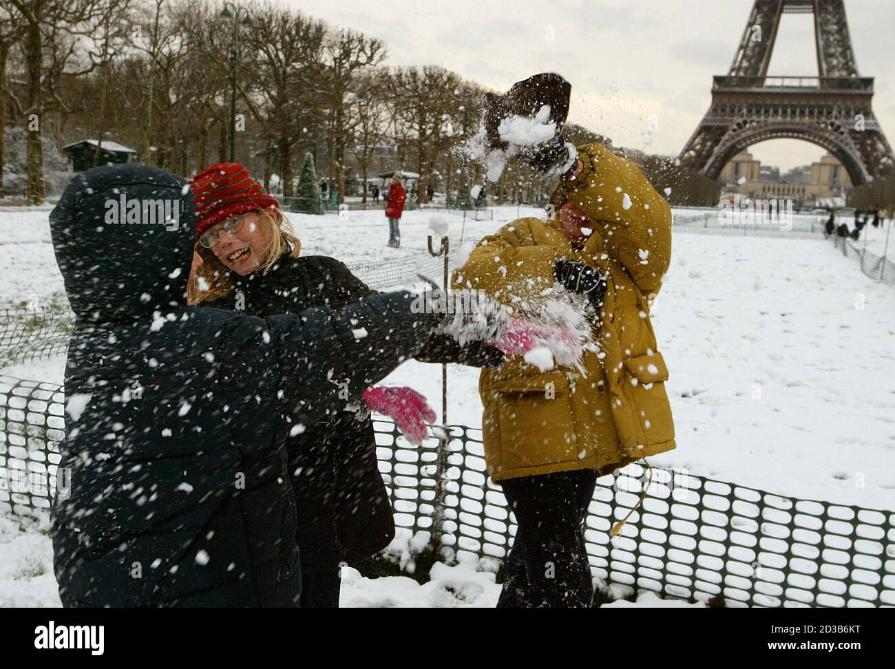 Children Play With Snow In Front Of The Eiffel Tower In Paris January 4 03 Meanwhile High Winds Cut Electricity To Thousands And Rain Exacerbated Flooding In Parts Of Western And Northwestern