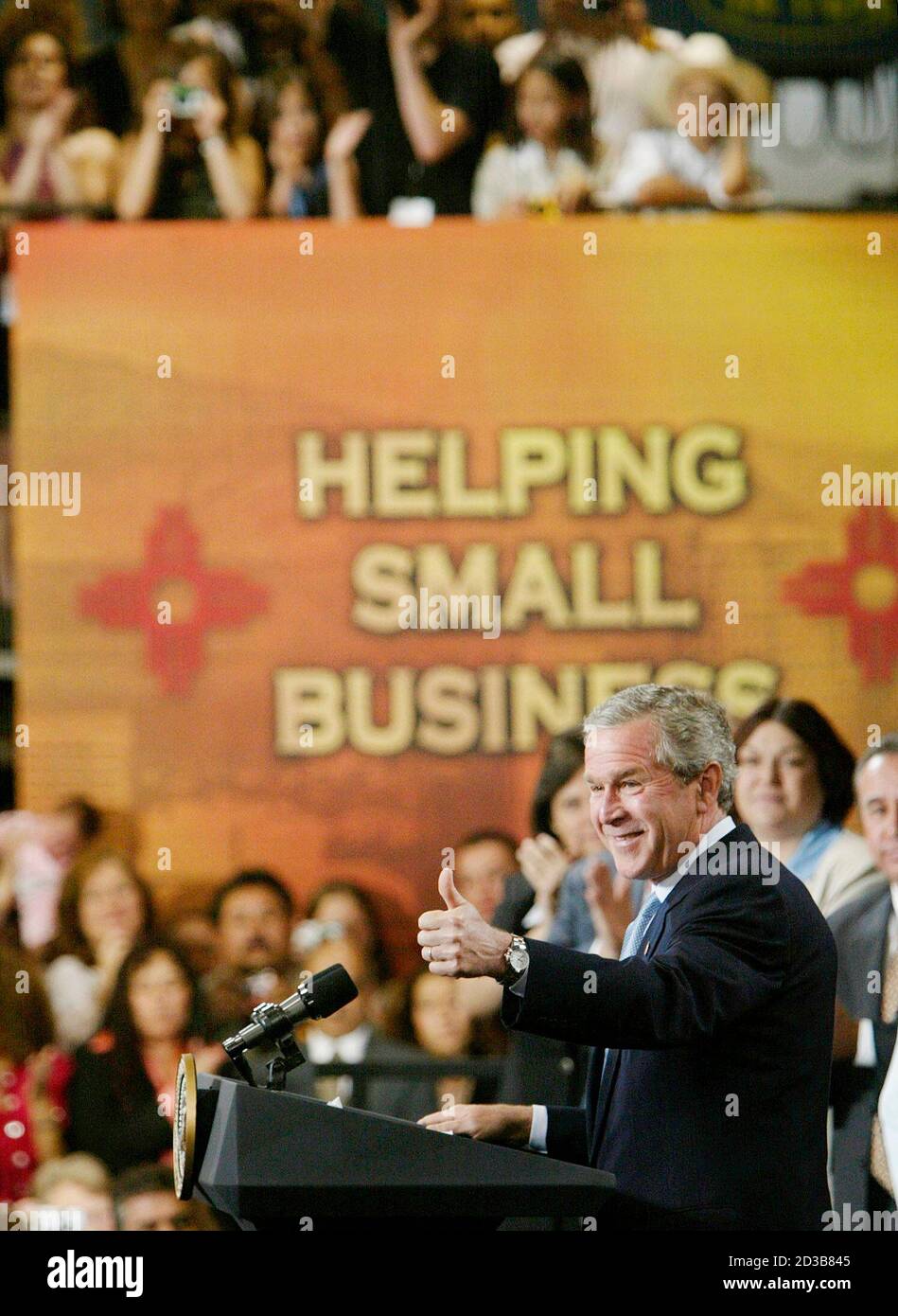 U.S. President George W. Bush pushes his jobs and growth plan while visiting MCT Industries in Bernalillo, New Mexico, May 12, 2003. Buoyed by polls showing public support for tax cuts may be on the rise, President Bush launched on Monday a three-state tour aimed at getting moderate Democrats in the Senate to drop their opposition to his half-trillion-dollar plan. REUTERS/Larry Downing  LSD Stock Photo