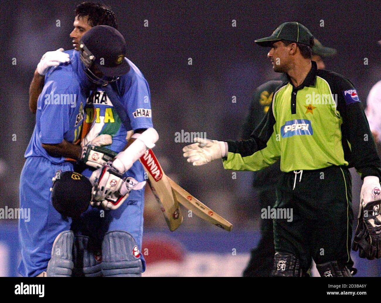 India S Rahul Dravid C And Mohammad Kaif L Face Hidden Embrace Each Other After Beating Pakistan As Pakistan S Moin Khan R Extends His Hand To Congratulate Them In The Fourth One Day International India S Rahul Dravid C And Mohammad Kaif L Face Hidden Embrace Each Other After Beating Pakistan As Pakistan S Moin Khan R Extends His Hand To Congratulate Them In The Fourth One Day International