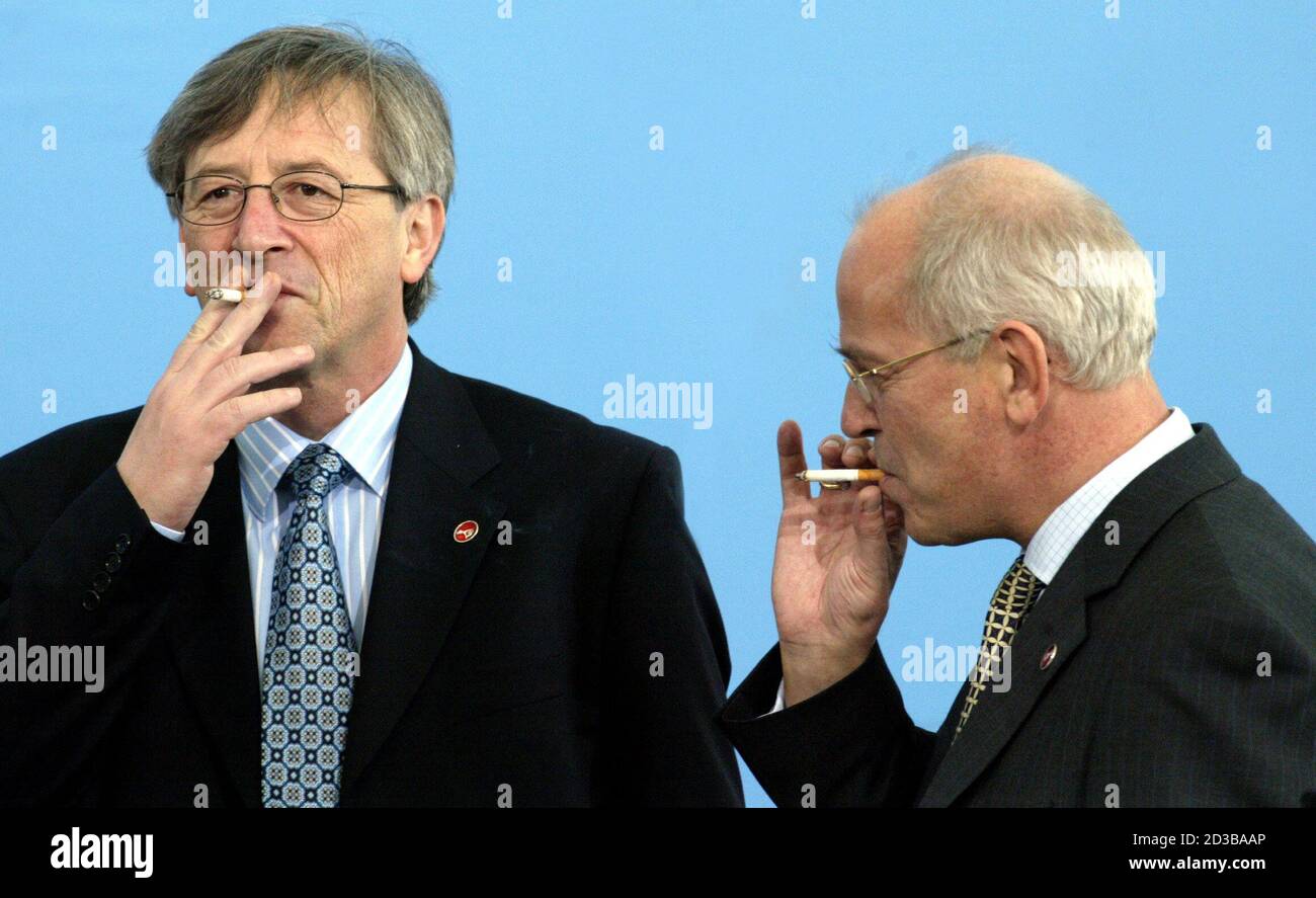 Jean Claude Junker, Luxembourg Prime Minister (L) joins Gerrit Zalm the  Dutch Finance Minister for a cigarette during the first day of the European  Union Economic and Finance Ministers meeting (ECOFIN) at